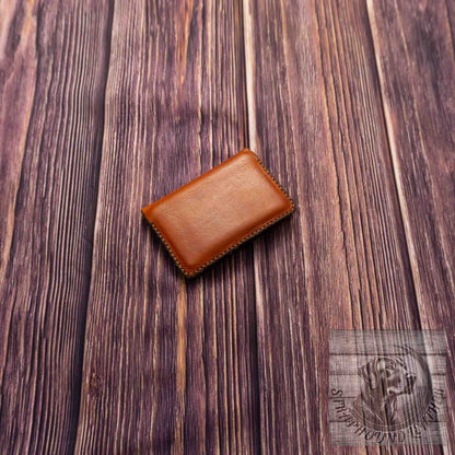 photo of wood grain background with a walnut leather wallet