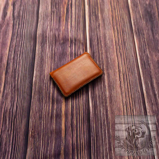 photo of wood grain background with a walnut leather wallet