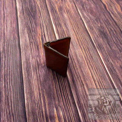 photo of wood grain background with a walnut leather wallet